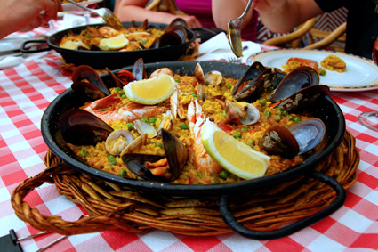Soak up the flavors of Paella: saffron, rosemary, olive oil, seafood!